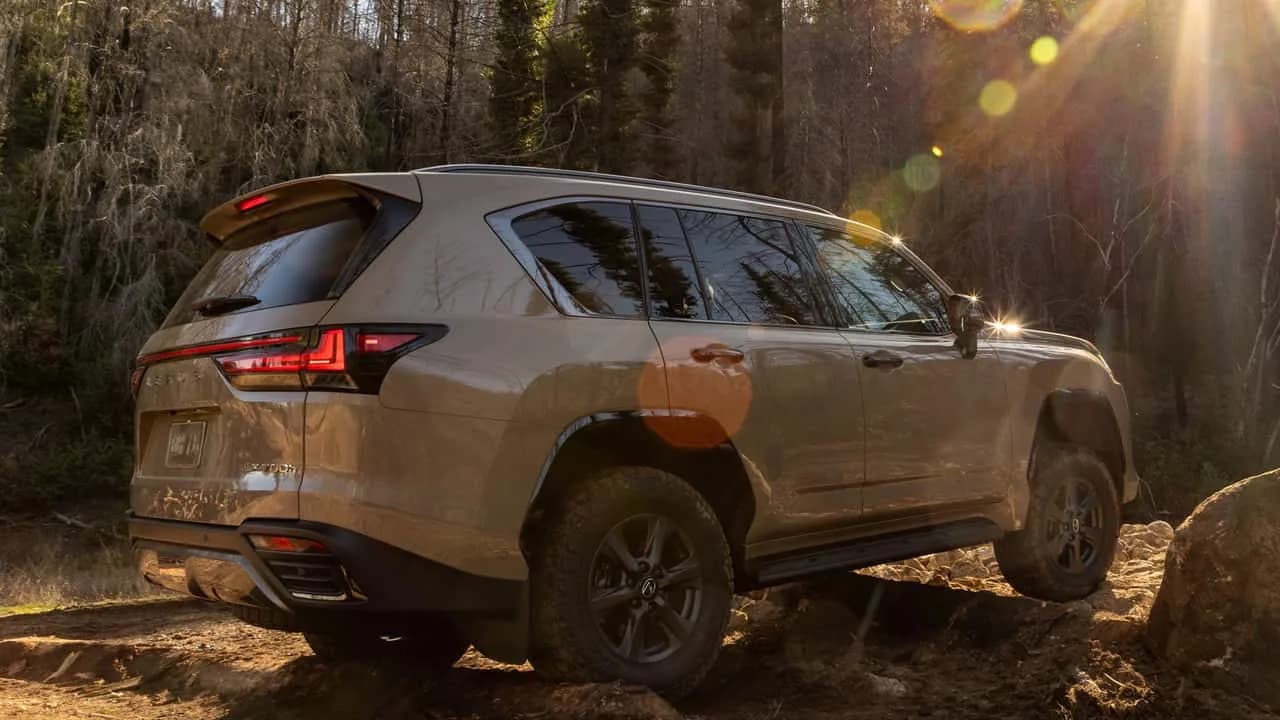 2027 Lexus LX luxury SUV parked outdoors showing its spindle grille and updated wheels