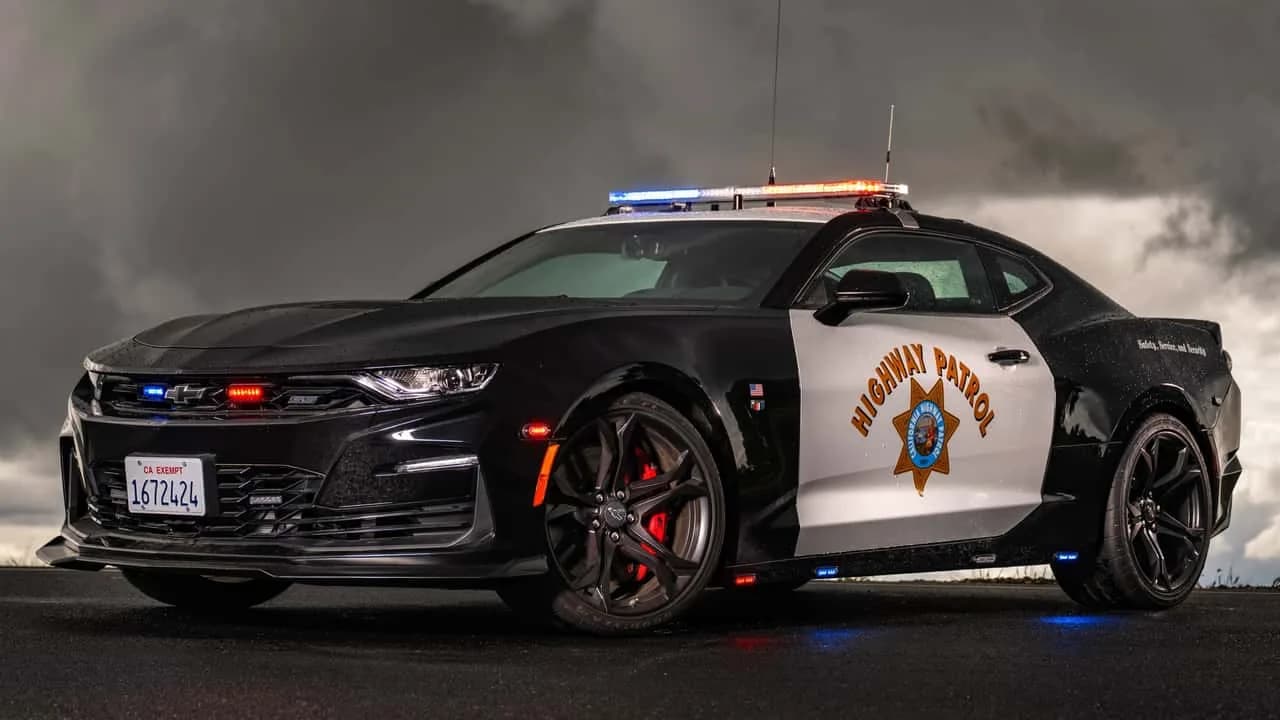 Black-and-white Chevrolet Camaro SS 1LE CHP patrol car with decals, push bar and emergency lighting
