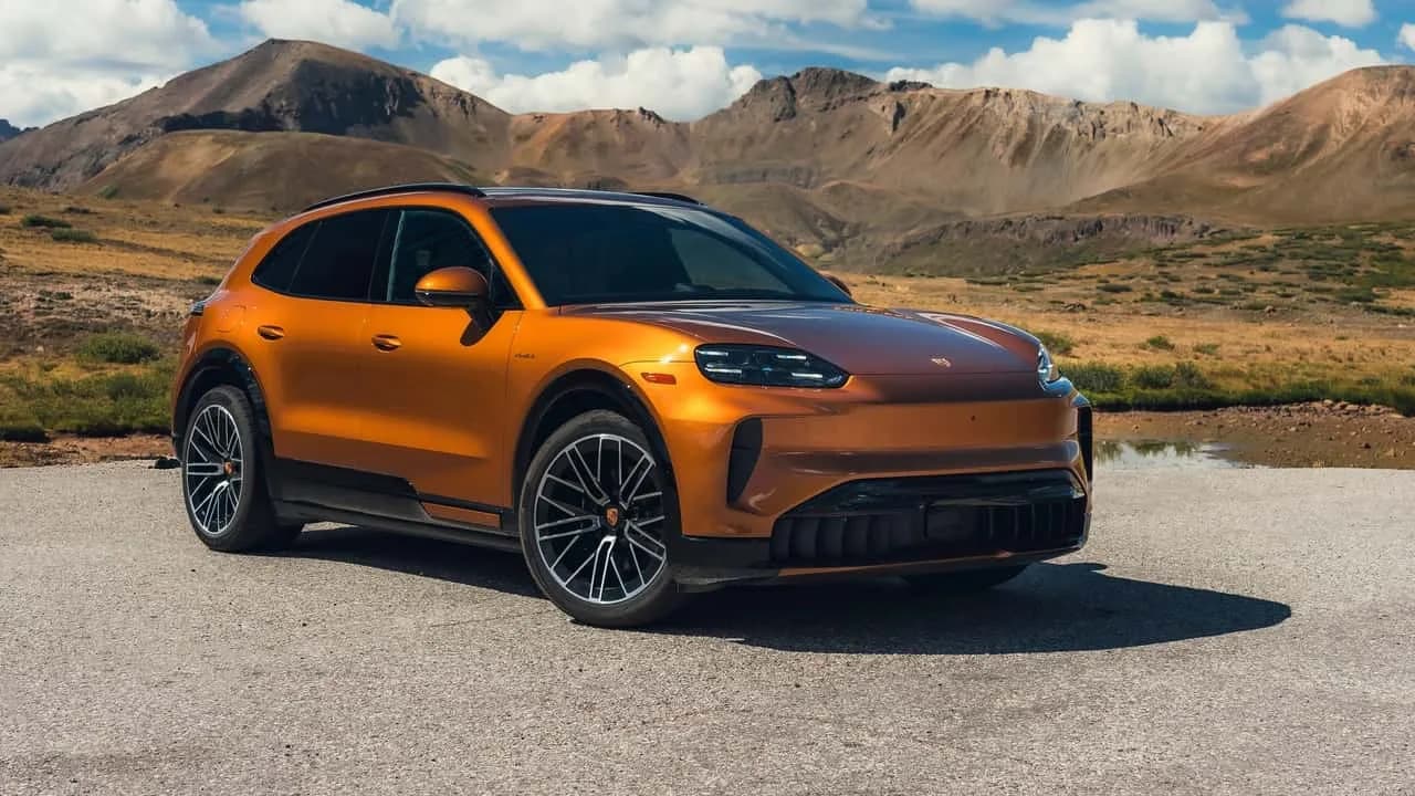 2027 Porsche Cayenne Electric parked outdoors with its doors open