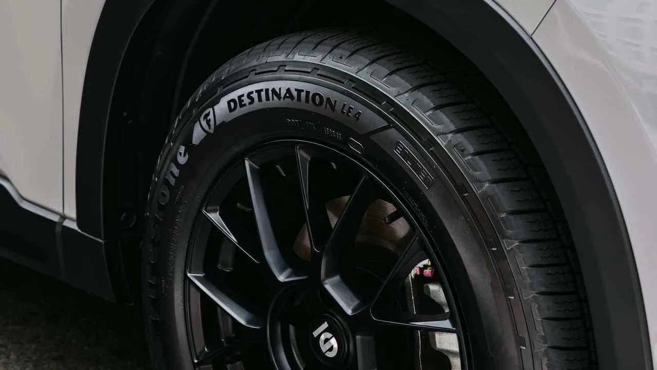 Firestone Destination LE4 all-season tire displayed against a clean background