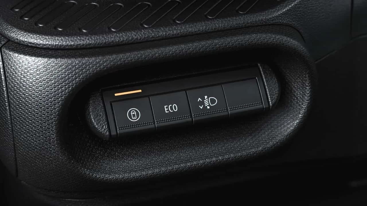 Dacia vehicle interior showing the physical My Safety button and dashboard controls